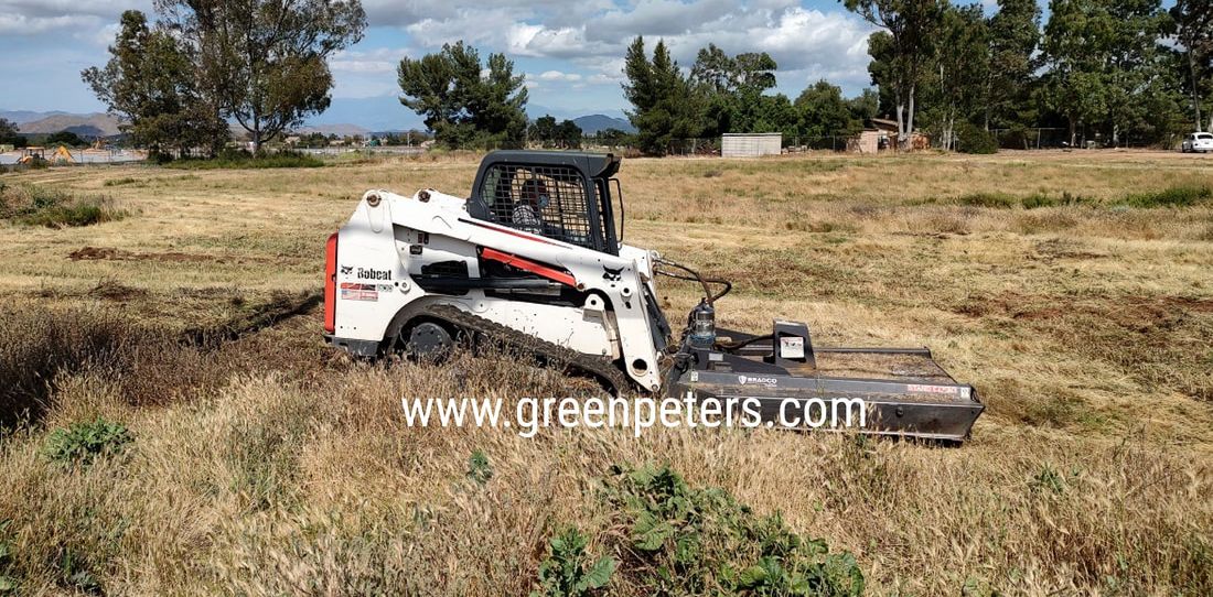 Weed abatement contractor mowing weeds for fire clearance