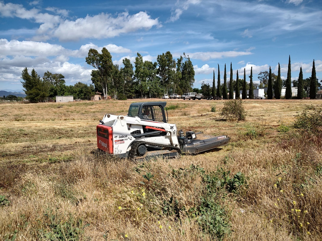 Bobcat mowing for fire clearance and weed abatement Menifee Ca
