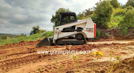 Landcape contractor preparing and grading the land for agriculture 